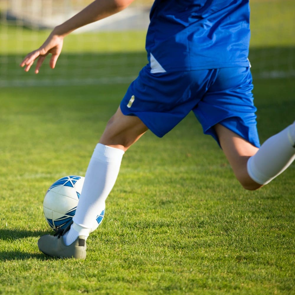 Young man about to kick a ball